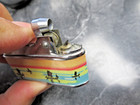 Vintage Sunflower Made in China Petrol Lighter Junk Boats on Water During Sunset — photo 6
