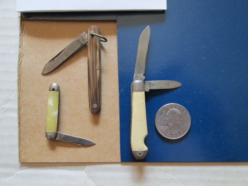 A collection of tiny guns & knives from the 50's-60's