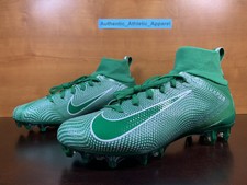 green and gold cleats