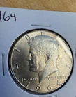 1964 50C Kennedy Half Dollar. BU. Unc. condition. Toning.