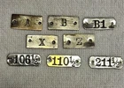 LOT OF EIGHT NICKLE PLATE ANTIQUE DRAWER FRONT OR DOOR NUMBER & LETTER I.D.TAGS