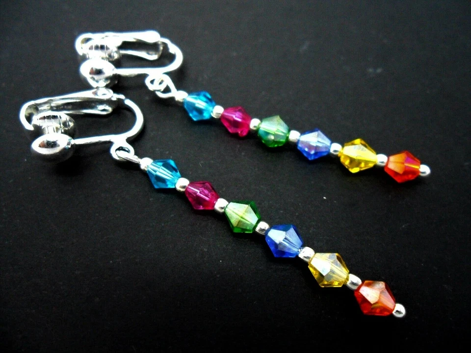 A PAIR OF RAINBOW CRYSTAL GLASS BEAD SILVER PLATED CLIP ON EARRINGS. NEW. - Image 1 of 1