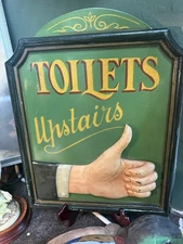 Vintage Decorative Style Toilet Upstairs Sign With A 3D Relief Of Hand Thumbs Up