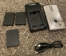 Used Canon PC1060 IXY Compact Digital Camera with Charger and 3 Battery