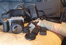 Hasselblad X1d 50c, Lens XCD 45P, two batteries, charger, RR cage, strap, boxes.