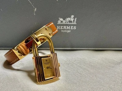 Bracelet montre HERMES Kelly cuir marron doré accessoire de mode avec étui oc... - Photo 1/4