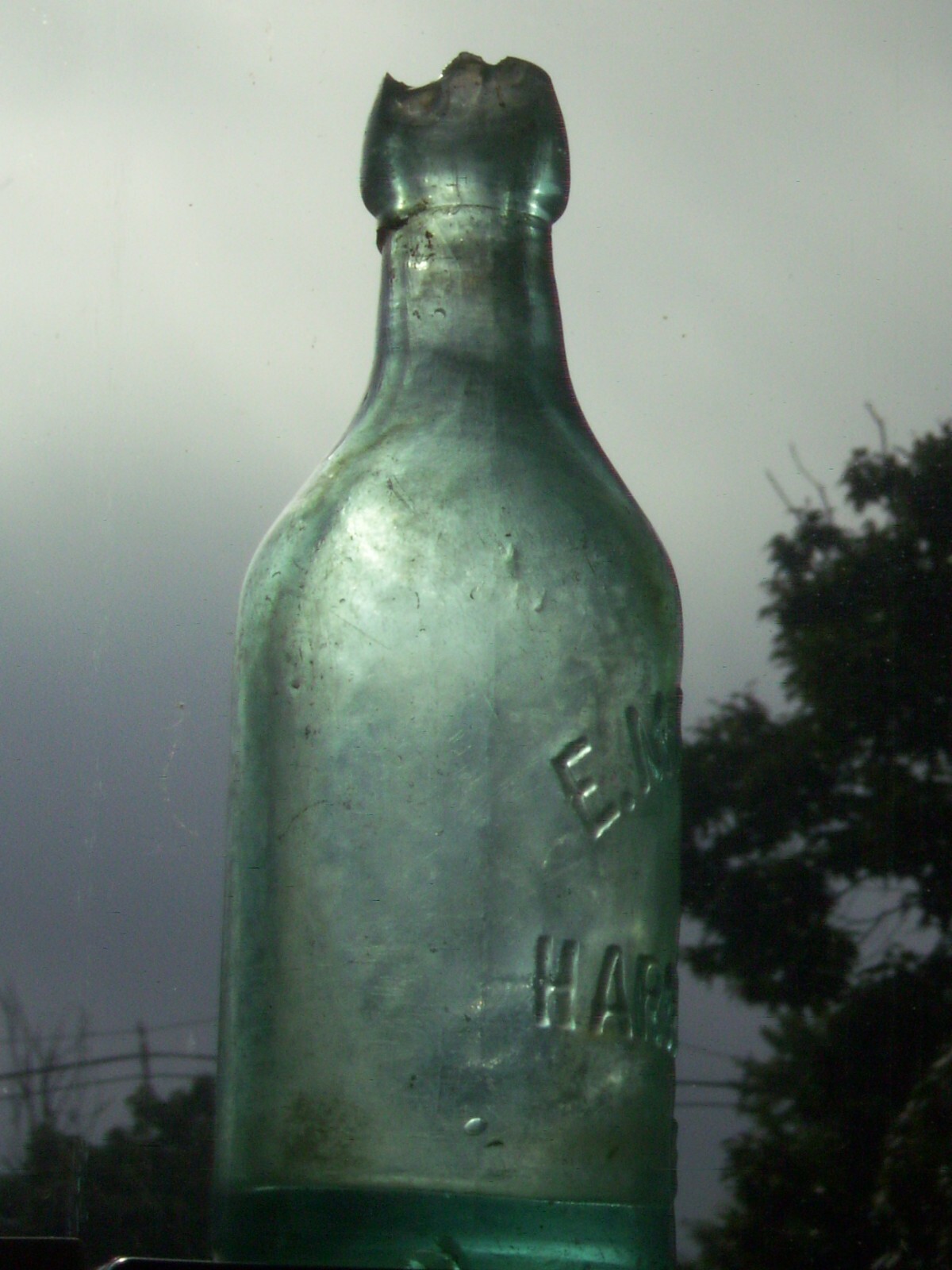 Vintage blue embossed  E. Marsili Harrisburg, Pa. affixed blob top glass bottle