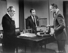 John Le Mesurier listens to David Niven explain the content of - 1965 Old Photo