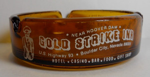 CASINO ASHTRAY GOLD STRIKE INN BOULDER CITY NV.  amber glass 3 1/2" in diameter