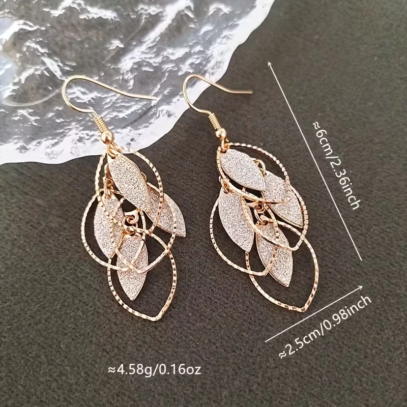 Elegantes pendientes colgantes de hojas para mujer - púrpura minimalista inspirado en la naturaleza Foto 2 de 2