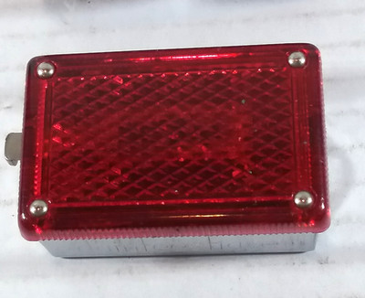 Daintieieshave (looks like a red tail light)in small leather pouch