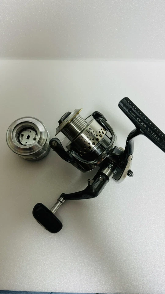 Shimano 01 Stella AR 3000 con juego de carretes de repuesto Studio Ocean Mark - Imagen 2 de 4