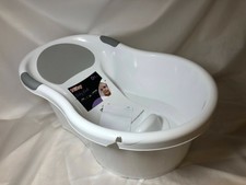 nuby baby bath with built in seat and soft headrest