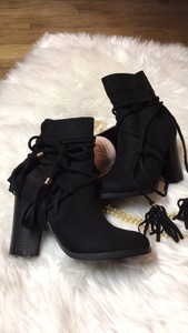 black suede ankle boots with tassels