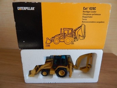 NZG CATERPILLAR CAT 428C BAGGERLADER FAHRZEUG BAGGER TRACTO + BOX MASSSTAB 1:50