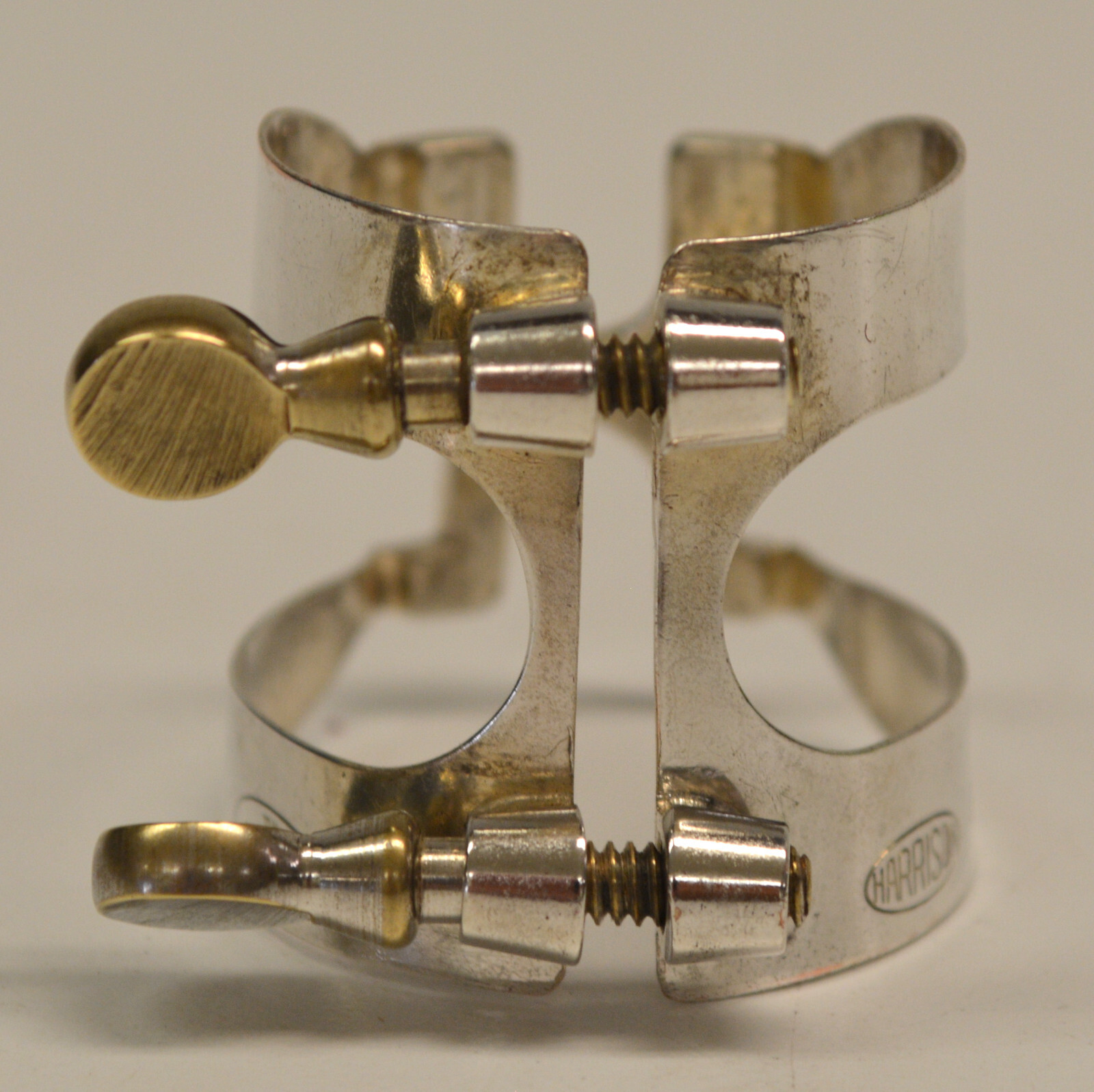 USED VINTAGE HARRISON BARI SAX LIGATURE W/PATENT REFERENCE, MARKED BSL