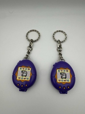 Lot of 2 McDonald s Tamagotchi Keychain 1997 Purple Virtual Pet Toy