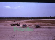 35mm photo slide 1960s Vietnam USAF flight line P-64 T-6 ? aircraft a37