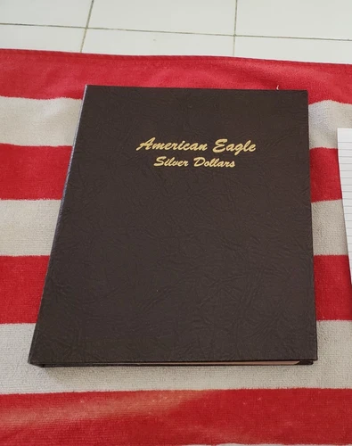 33 silver eagles lot in Dansco folder