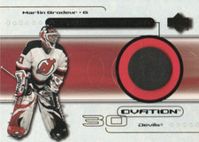 1999-00 Upper Deck Ovation A Piece Of History (Puck) #MB Martin Brodeur (1:118)