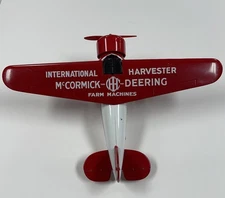 1932 Lockheed Vega Model 5 airplane coin bank McCormick-Deering Farm Machines 