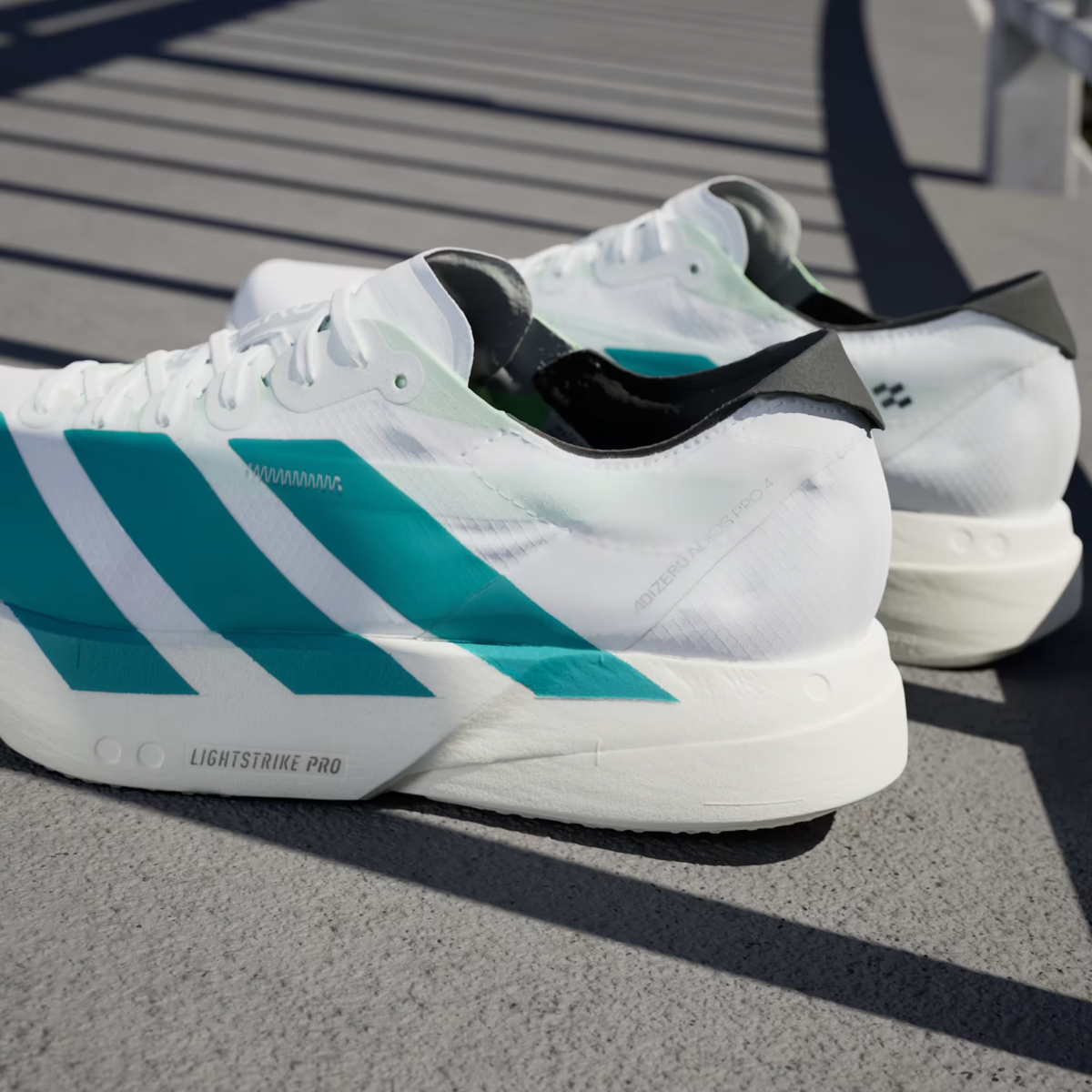 Adizero Adios Pro 4 Running Shoes in Cloud White/Pure Teal