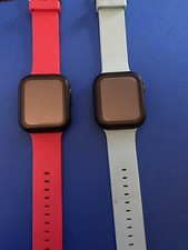 2 Apple Watches Series 5 40mm Space Gray with Support Bands And Cases.