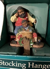 Santa Overseeing Boy Studying Stocking Holder (AA) Vintage, New In Box, No Damag