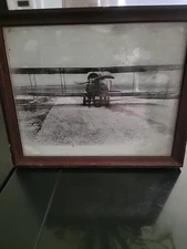 aeronautical world war 1 biplane with pilots out front very cool picture.!!!!