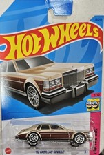 2023 HOT WHEELS- ‘82 Cadillac Seville Gold #75/250 HW: The 80s #7/10 Long Card