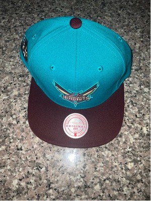 Mitchell & Ness Charlotte Hornets Buzz City snapback hat.
