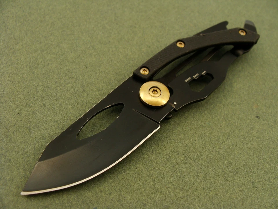 NAVAJA DE BOLSILLO PLEGABLE G10 MULTIHERRAMIENTA GADGET ORO NEGRO SMITH&WESSON HERRAMIENTAS Foto 3 de 4