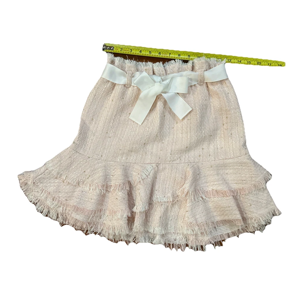 Hermosa falda de tweed rosa claro con lazo blanco Foto 4 de 4