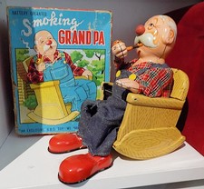 Vintage Tinplate Battery-Operated Smoking Grandpa Toy, Marusan, Japan. VGiB