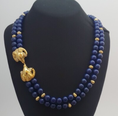 Vintage Kenneth Jay Lane Gold Tone/green eye Rams with Blue faux stone Necklace