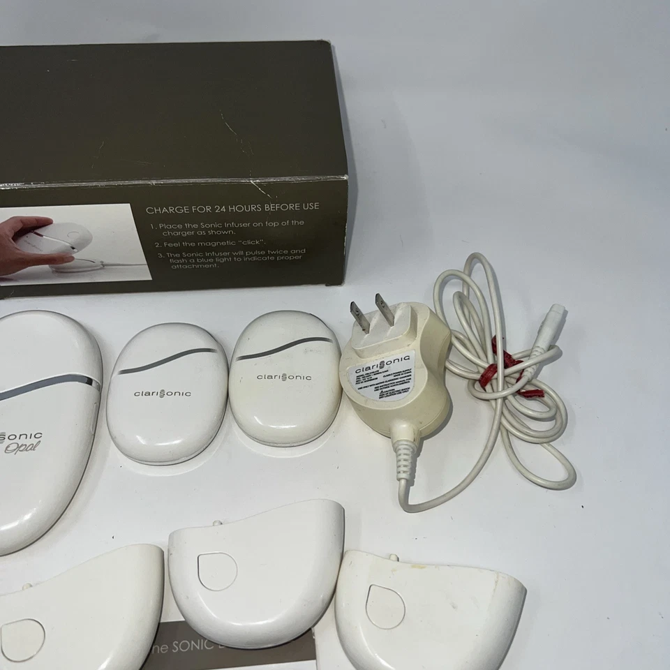 Lote de 6 cargadores de infusión sónicos Clarisonic Opal con 2 adaptadores de CA y caja Foto 3 de 4