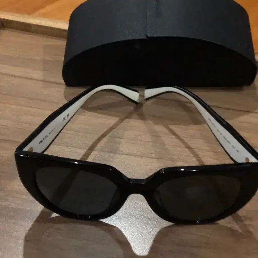 Prada Black Frame Sunglasses with White Accent