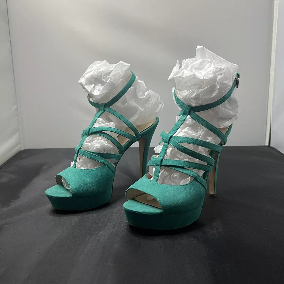 Turquoise heels with decorative soles