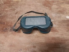 vintage unigoggle welding green in color