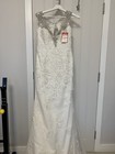 Wedding Dress size 14  new with tags elegant floor length in ivory  silver