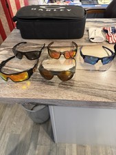 Five Pairs of Oakley Sunglasses 3 Hard Cases and A Carrying Case. Rarely Worn