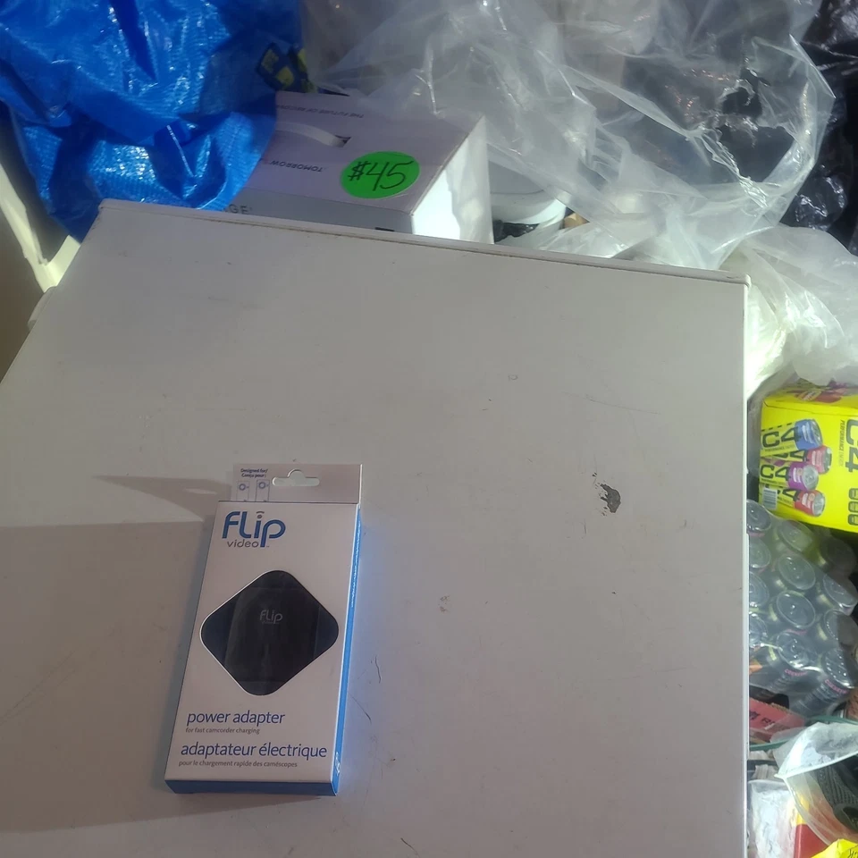 Nuevo adaptador de corriente Flip Video APA1B para carga rápida de videocámara Foto 3 de 3