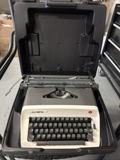 Vintage Olympia Automatic Electric Portable Typewriter with original hard case. thumbnail