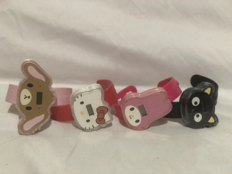 McDonalds Sanrio 2010 50 aniversario Lote de 4 relojes de juguete Happy Meal sin probar Foto 2 de 4