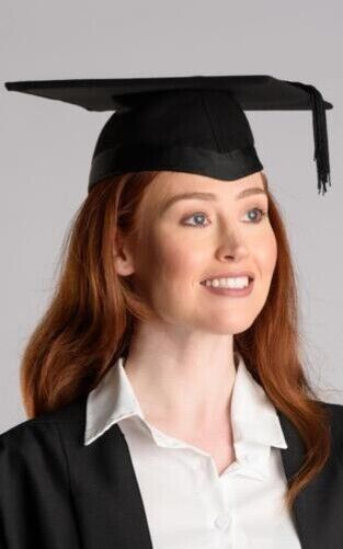 Graduate woman wearing mortarboard and academic dress. Smiling student  standing with arms crossed and holding diploma 10448925 Stock Photo at  Vecteezy