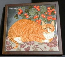 Avon Mimi Vang Olsen orange cat trivet approximately 7" square pre-owned