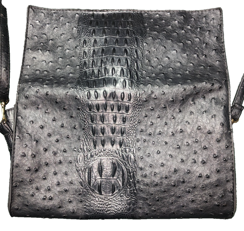 A Sleek Black Leather Tote Bag With Gold Toned Hardware, Leather