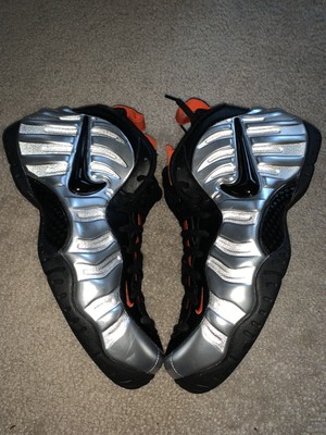 silver and orange foamposites