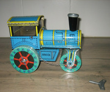 Ancien jouet mécanique Kovap en tôle métal Rouleau compacteur à vapeur