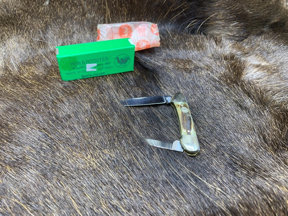 Cuchillo canoa bebé gallina y gallo 1992 con asas de ciervo como nuevo caja de fábrica - 143 Foto 3 de 4